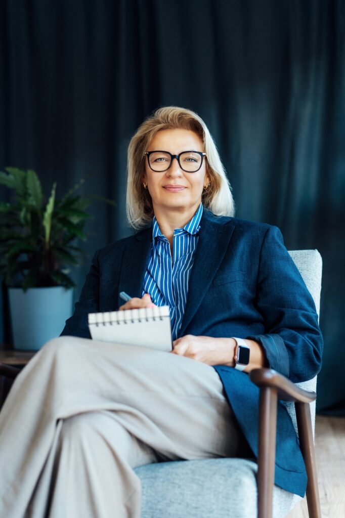 Portrait of smiling 50's stylish, confident mature businesswoman, middle aged company ceo director,